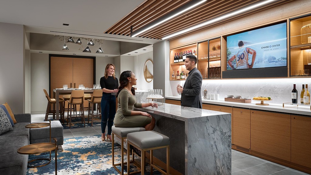 A man and woman in a restaurant.